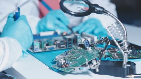 Closeup of a gloved hand installing a microchip on a blue motherboard. Perf.. Stock Footage 341547345