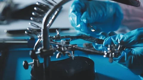 Closeup of a gloved hand installing a microchip on a blue motherboard. Perf.. Stock Footage 341547586