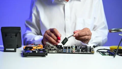 Closeup of gloved hands testing a CPU chip using multimeter. Ideal for tech.. Stock Footage 312773657
