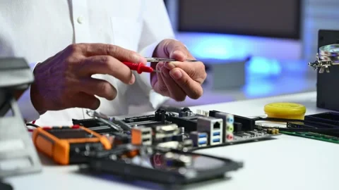 Closeup of gloved hands testing a CPU chip using multimeter. Ideal for tech.. Stock Footage 312773669