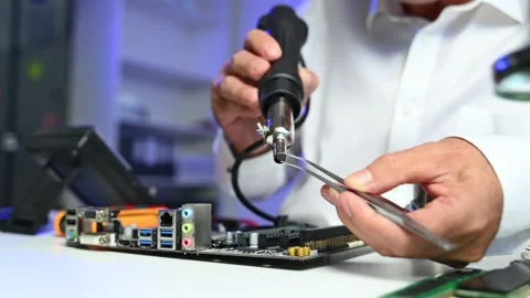 Closeup of gloved hands testing a CPU chip using multimeter. Ideal for tech.. Stock Footage 312773686