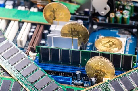 Closeup of gold bitcoin on computer components background, technology and dig 스톡 사진