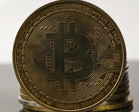 Closeup gold bitcoin with reflection Stock Photos