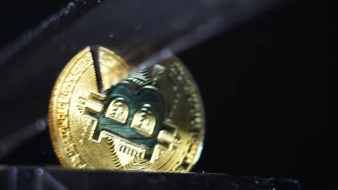 Closeup Golden Bitcoin Model Cut with Sharp Knife Video stock 80296963