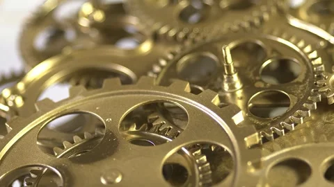 Closeup of golden clock gears and mechanisms Stock Footage 346076946