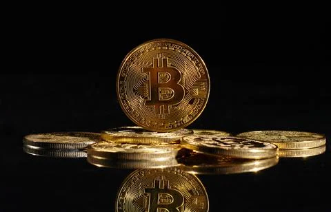 Closeup golden coin with bitcoin logo. Leader in cryptocurrency Bitcoin BTC on a Stock Photos