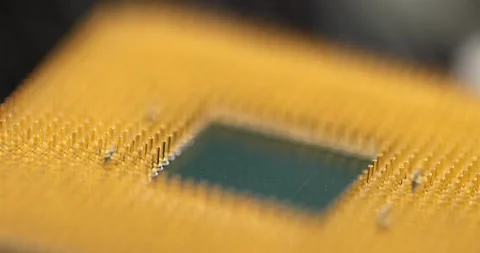 Closeup of golden microprocessor computer parts 4k movie slow motion Video stock 165172562