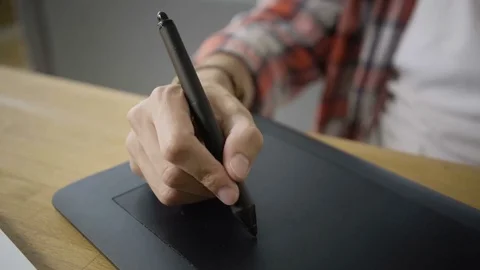 Closeup of graphic designer drawning on graphics tablet Stock Footage 79797033