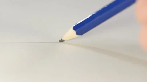 Closeup graphite blue pencil drawing line on paper. Macro of designer writing Stock Footage 143557064