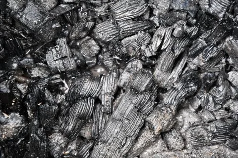 Closeup of gray abstract texture of cooling down wooden coal and cinders Stock Photos