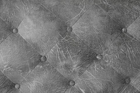 Closeup gray leather with buttons texture background. Stock Photos