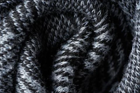 Closeup gray texture of woolen knitted fabric. Pattern of gray crumpled fabri Stock Photos