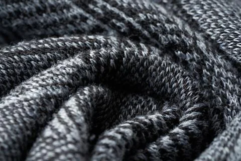 Closeup gray texture of woolen knitted fabric. Pattern of gray crumpled fabri Stock Photos