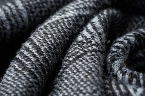 Closeup gray texture of woolen knitted fabric. Pattern of gray crumpled fabri Stock Photos