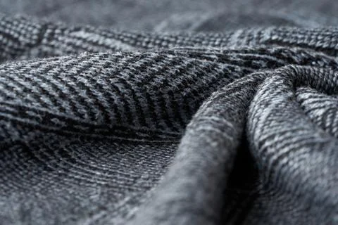 Closeup gray texture of woolen knitted fabric. Pattern of gray crumpled fabri Stock Photos