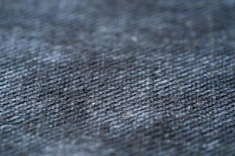 Closeup gray texture of woolen knitted fabric. Pattern of gray crumpled fabri Stock Photos