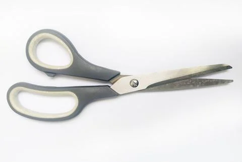 Closeup of grayhandled scissors against a white background.  A simple yet ver Stock Photos