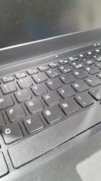 A closeup of a grey black computer keyboard Stock Photos