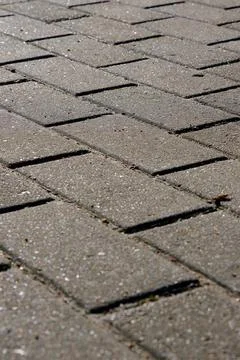 Closeup of grey pavement made of rectangular paving stone Stock Photos