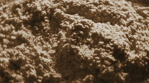 Closeup of grey powder being sprayed and covering a surface Stock Footage 97683144