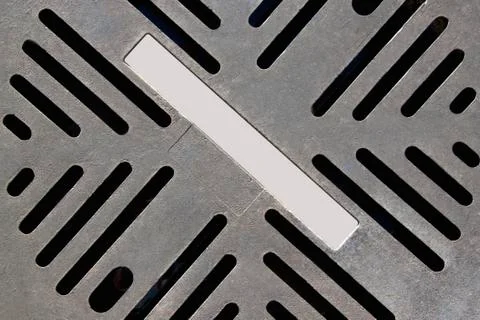 Closeup of grid pattern on metal cover plate Stock Photos
