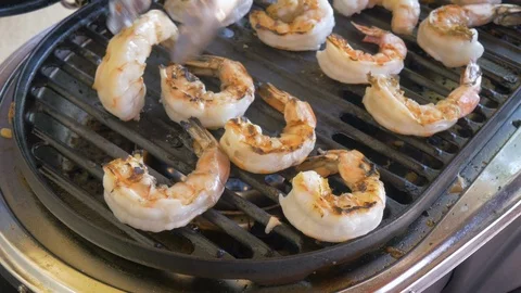 Closeup of Grilling Fresh Shrimp on a Propane Grill in 4k Stock Footage 99015996