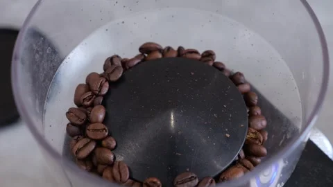 Closeup Of Grinding Process. Detailed View Of Coffee Beans Being Processed In Stock Footage 330396488