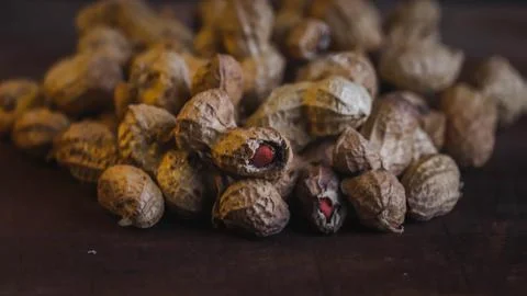 Closeup of Groundnuts kept on a black background Fotos de archivo