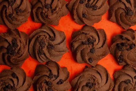 Closeup of a group of assorted dark chocolate chip cookies. Top view. Stock Photos