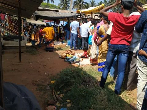 Closeup of group of people queue at Aarathi Ukkada Ahalya Devi Maramma Temp.. Stock Photos