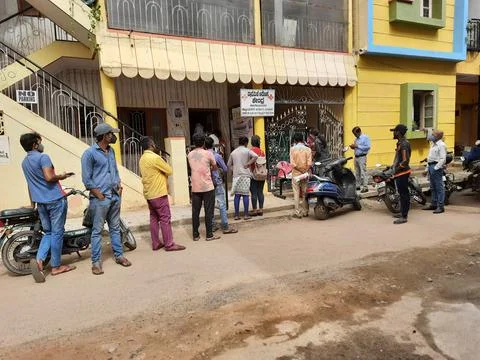 Closeup of group of peoples standing in a queue to take Covid 19 Vaccination  Stock Photos