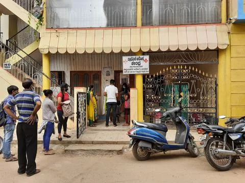 Closeup of group of peoples standing in a queue to take Covid 19 Vaccination  Stock Photos