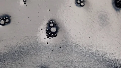 Closeup of groups of tiny bubbles slowly going down inside a detergent Vídeos de archivo 122102684