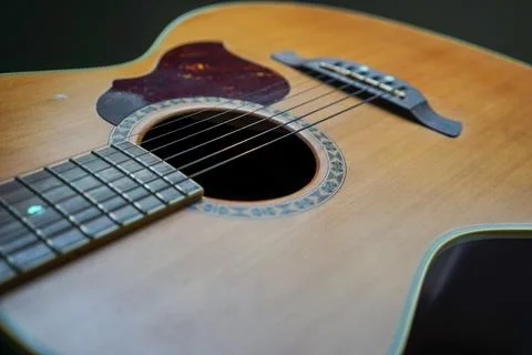 Closeup guitar with light from window Stock Photos