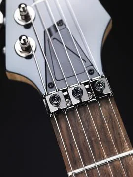 Closeup of guitar neck with string lock and locking nuts Foto stock