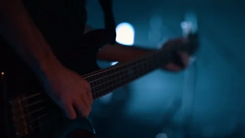 Closeup Guy Playing Bass Guitar on Stage Stock Footage 86439953