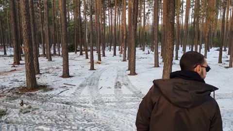 Closeup a guy walking in a forest. Backview. Stock Footage 132557778