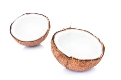 Closeup half of brown coconut shell on white background Stock Photos
