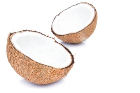 Closeup half of brown coconut shell on white background Stock Photos