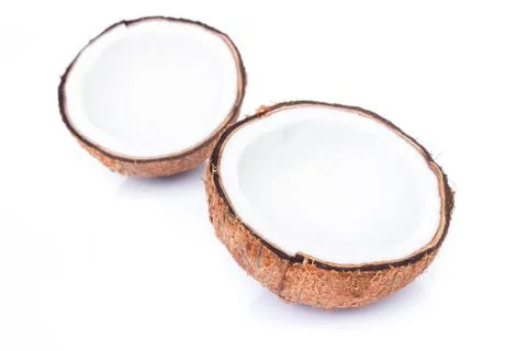 Closeup half of brown coconut shell on white background Stock Photos