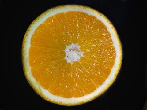 Closeup of a half cut orange Stock Photos