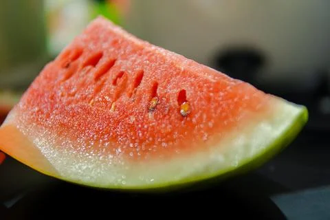 Closeup. Half cut of watermelon on the table Stock Photos