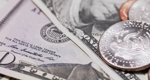 Closeup of Half Dollar coin on top of US Dollar Banknotes and different coins Video stock 158653636