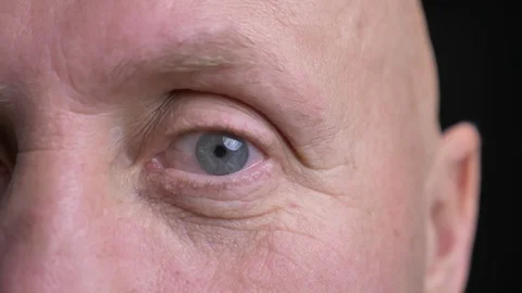 Closeup half-face portrait of middle-aged caucasian man with eye looking Video stock 103362383