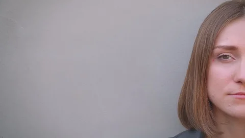Closeup half face portrait of young cute caucasian girl smiling happily looking Video stock 110236900