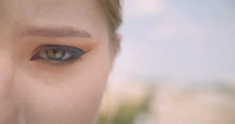 Closeup half face portrait of young cute caucasian female face with eye looking Stock Footage 113274884