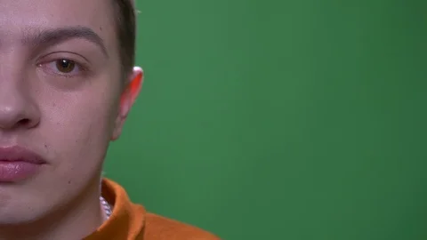 Closeup half face shoot of young attractive caucasian male with eyes looking at Stock Footage 108666693