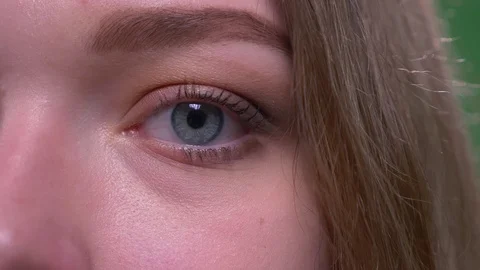 Closeup half face shoot of young attractive short haired female looking at Stock Footage 108689441