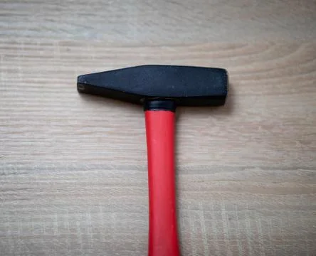 Closeup hammer on the table. Stock Photos