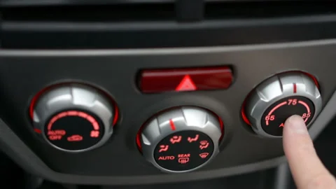 Closeup of hand adjusting the air conditioner button in the car. Man using Stock Footage 98419703